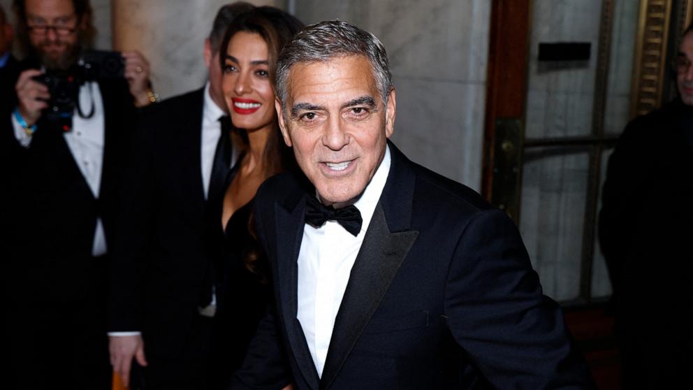 PHOTO: George Clooney and his wife Lebanese-British barrister Amal Clooney arrive for "The Albies" hosted by the Clooney Foundation for Justice at the New York Public Library in New York, Sept. 26, 2024. 