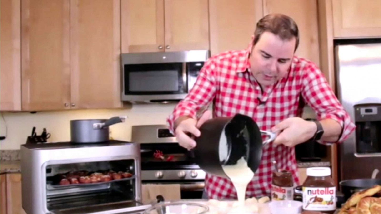 PHOTO: Chef George Duran cooks a cheese sauce and air fryer pretzels on "Good Morning America."