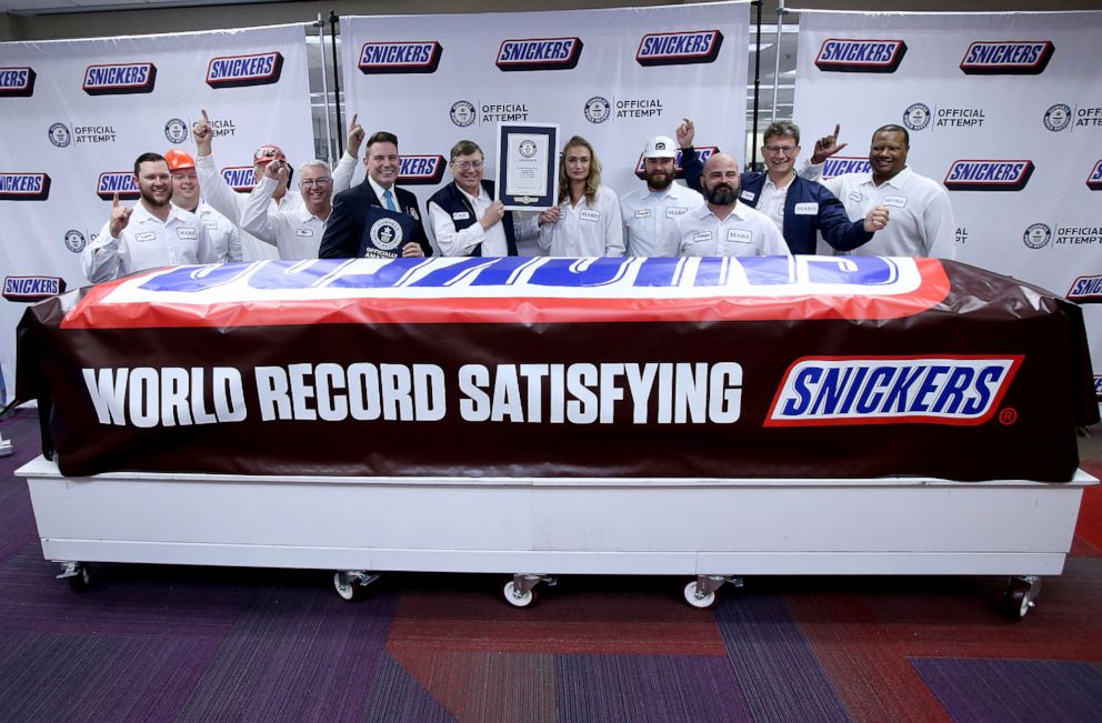 PHOTO: Mars Wrigley employees pose, Jan. 16, 2020, with a giant Snickers bar made at the Hewitt plant in Waco, Texas.