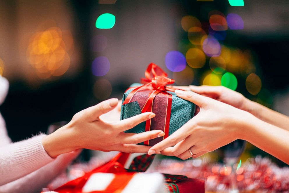 PHOTO: In this stock image, two people exchange a gift.