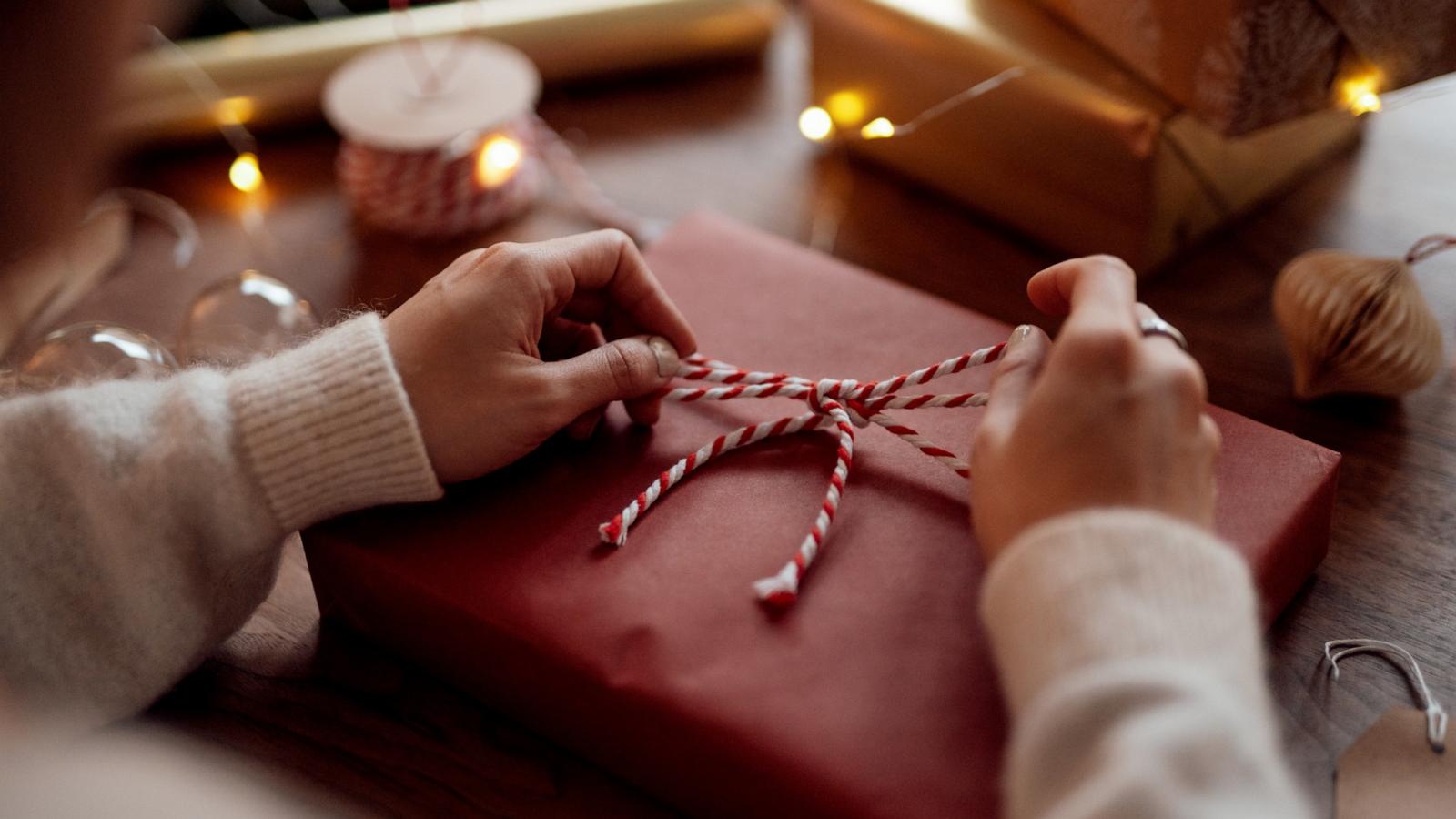 PHOTO: Stock photo of a gift being wrapped.