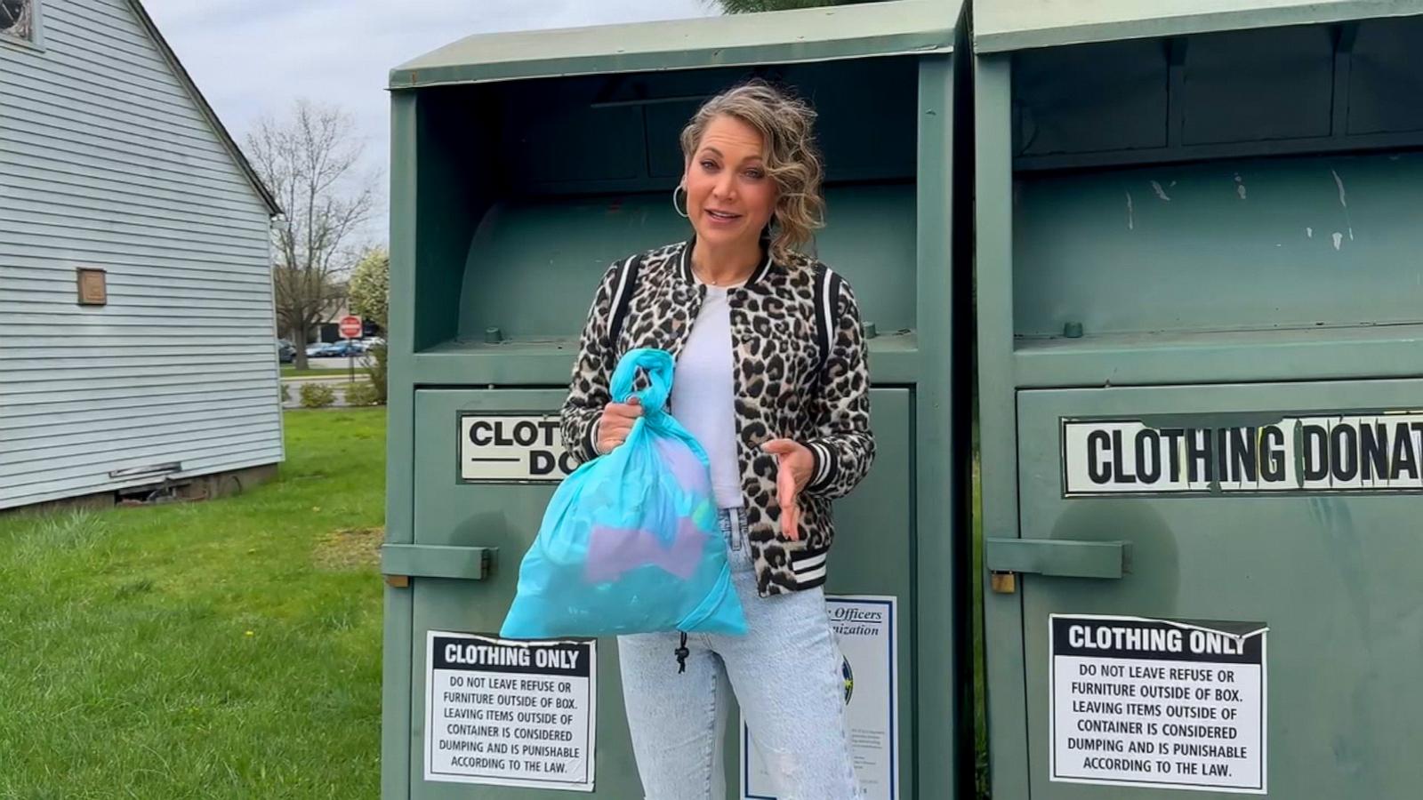 PHOTO: ABC News Chief Meteorologist Ginger Zee examines how donated clothes are processed.