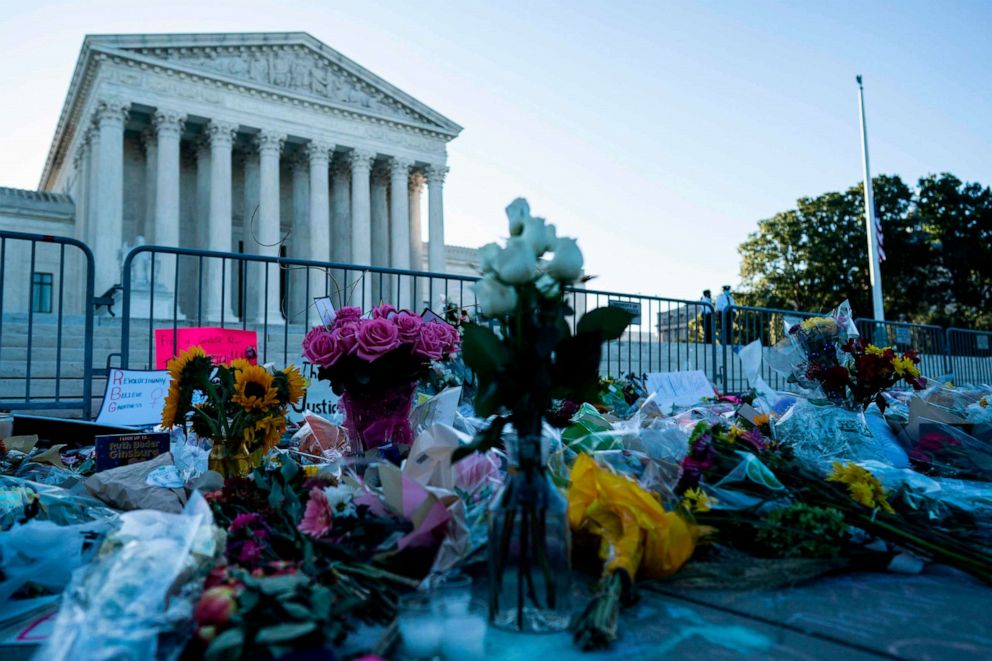 PHOTO: A makeshift memorial for late US Supreme Court Justice Ruth Bader Ginsberg is seen near the steps of the US Supreme Court, Sept. 21, 2020, in Washington, DC.