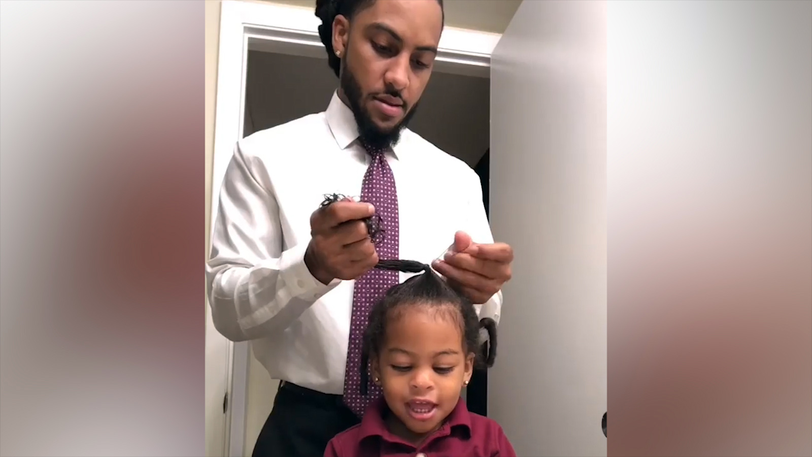 PHOTO: J.R. Rivera, a high school teacher in Miami, Fla., does his 2-year-old daughter Azariah's hair in the morning.