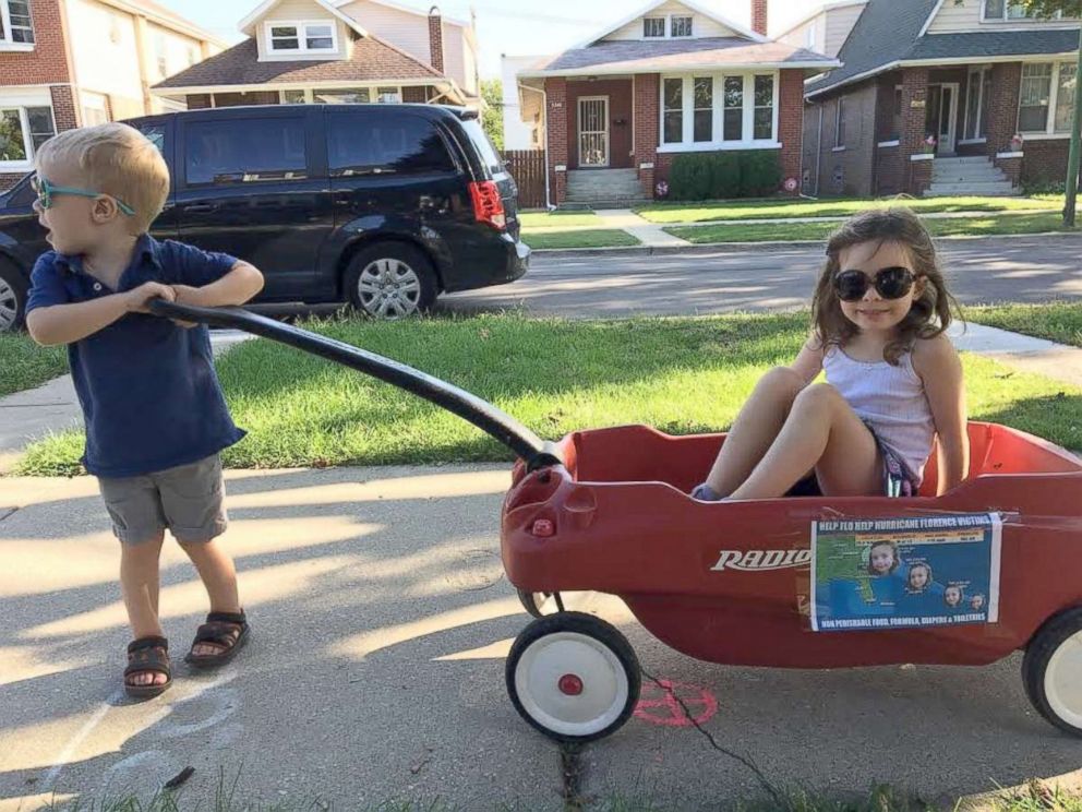 PHOTO: Florence Wisniewski, 4, is pulled in a red wagon by her younger brother, Bud Wisniewski.