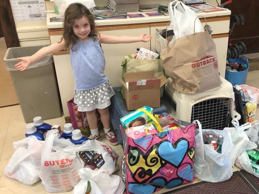 PHOTO: Florence Wisniewski, 4, stands with some of the donations she has raised for Hurricane Florence victims.
