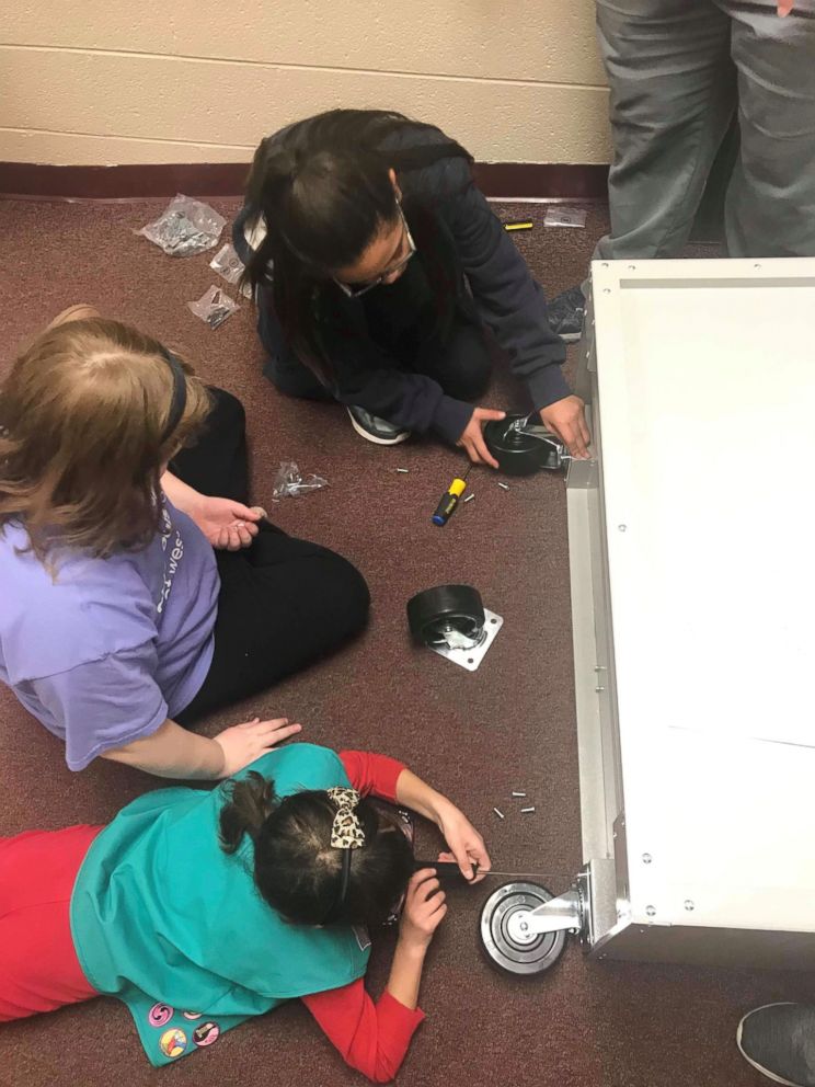 PHOTO: Girl Scouts of Western Ohio helped install a feminine hygiene locker in their school bathroom. 