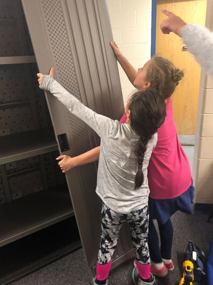 PHOTO: Girl Scouts of Western Ohio helped install a feminine hygiene locker in their school bathroom. 