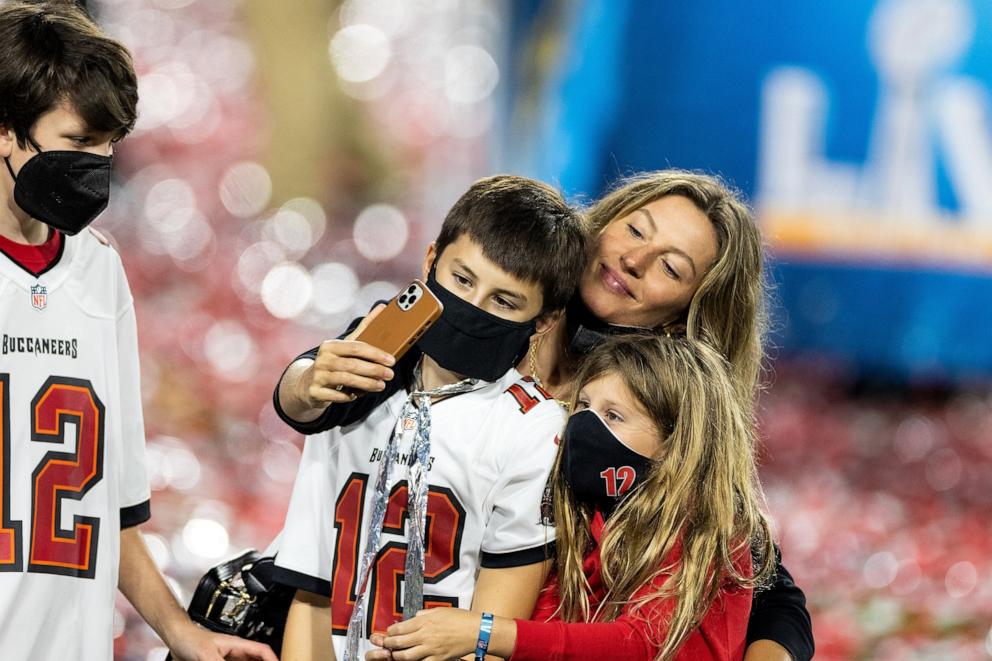 PHOTO: In this Feb. 7, 2021, file photo, Gisele Bundchen takes a selfie with Benjamin Brady, John Moynahan and Vivian Brady after the finish of Super Bowl LV at Raymond James Stadium in Tampa, Fla.