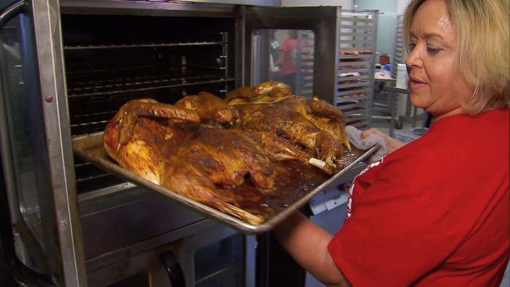 PHOTO: Residents are slowly picking up the pieces, and as a way to show their community's resiliency, the Bay School District hosted a Thanksgiving dinner event for members of the community, with the help of Nestle which donated truckloads of ingredients.