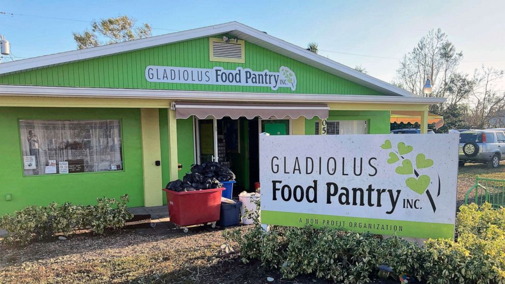 PHOTO: Garbage is piled outside the Gladiolus Food Pantry in Harlem Heights, Fla., Oct. 1, 2022. The Gladiolus Food Pantry usually hands out supplies on Wednesdays, but had to close due to Hurricane Ian and the food they had collected got spoiled.  