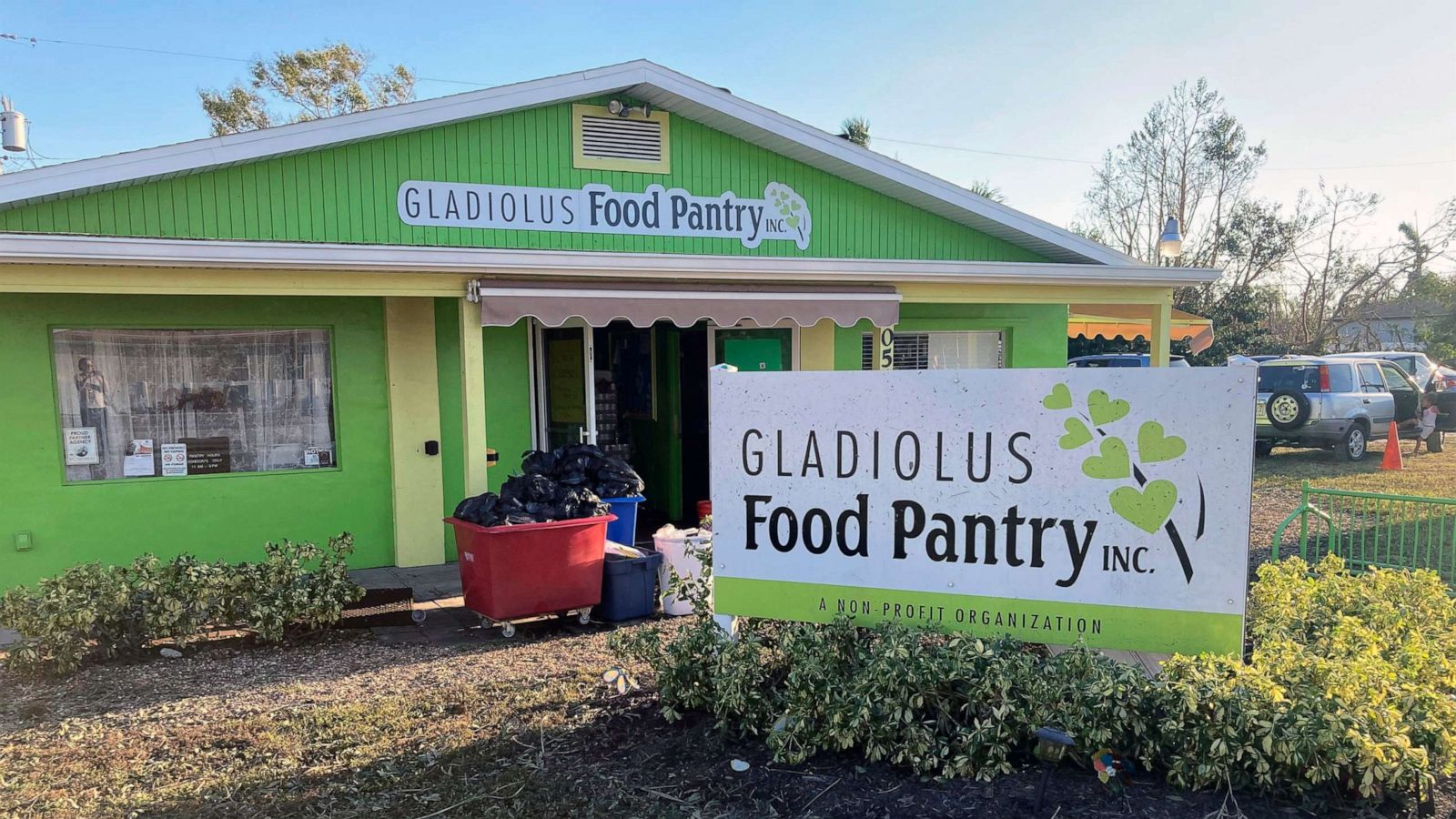 PHOTO: Garbage is piled outside the Gladiolus Food Pantry in Harlem Heights, Fla., Oct. 1, 2022. The Gladiolus Food Pantry usually hands out supplies on Wednesdays, but had to close due to Hurricane Ian and the food they had collected got spoiled.