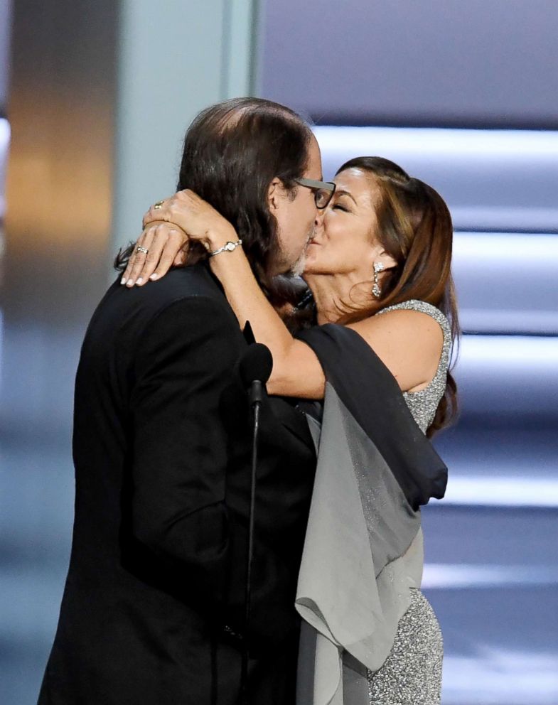 PHOTO: Glenn Weiss (L), winner of the Outstanding Directing for a Variety Special award for "The Oscars," and Jan Svendsen kiss after getting engaged during the 70th Emmy Awards on Sept. 17, 2018, in Los Angeles.