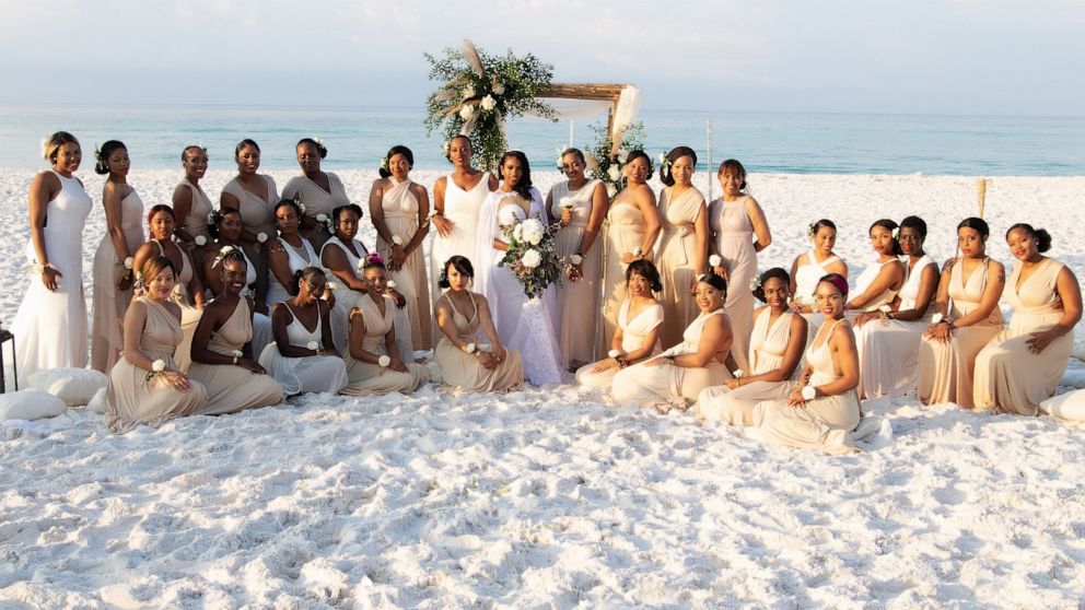 VIDEO: Woman has 34 bridesmaids by her side on her wedding day