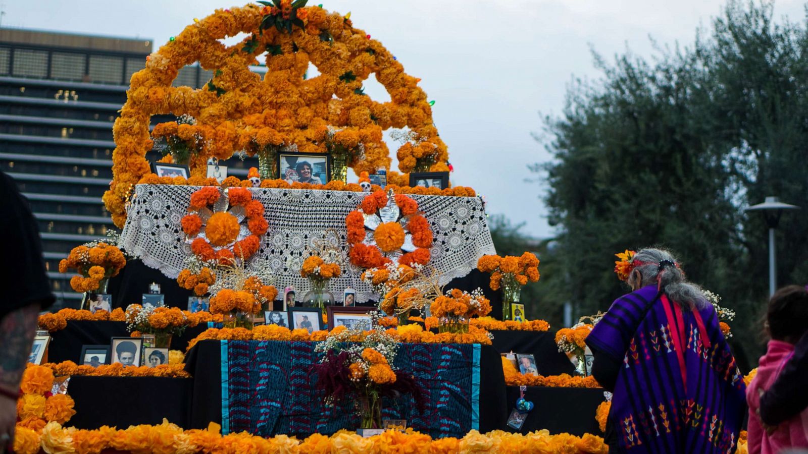 PHOTO: Folk artist Ofelia Esparza builds the community altar at Grand Park, Los Angeles.