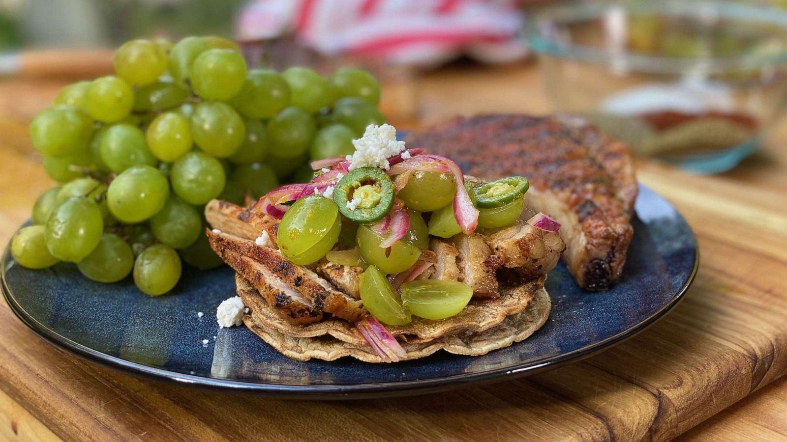 PHOTO: Pati Jinich's Grilled Chile Pork Chop and Pickled Grape Salad Tostada