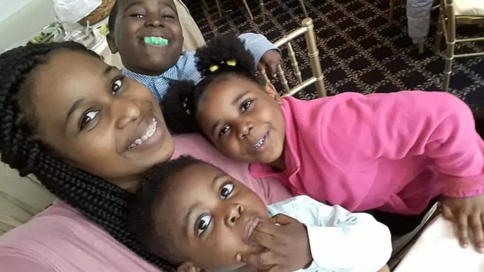 PHOTO: Alreema Vining, a doula, poses with her three children.