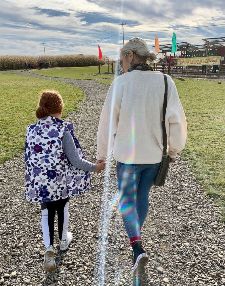 PHOTO: Beth McDonough, of Pennsylvania, walks alongside her 9-year-old stepdaughter Mia.