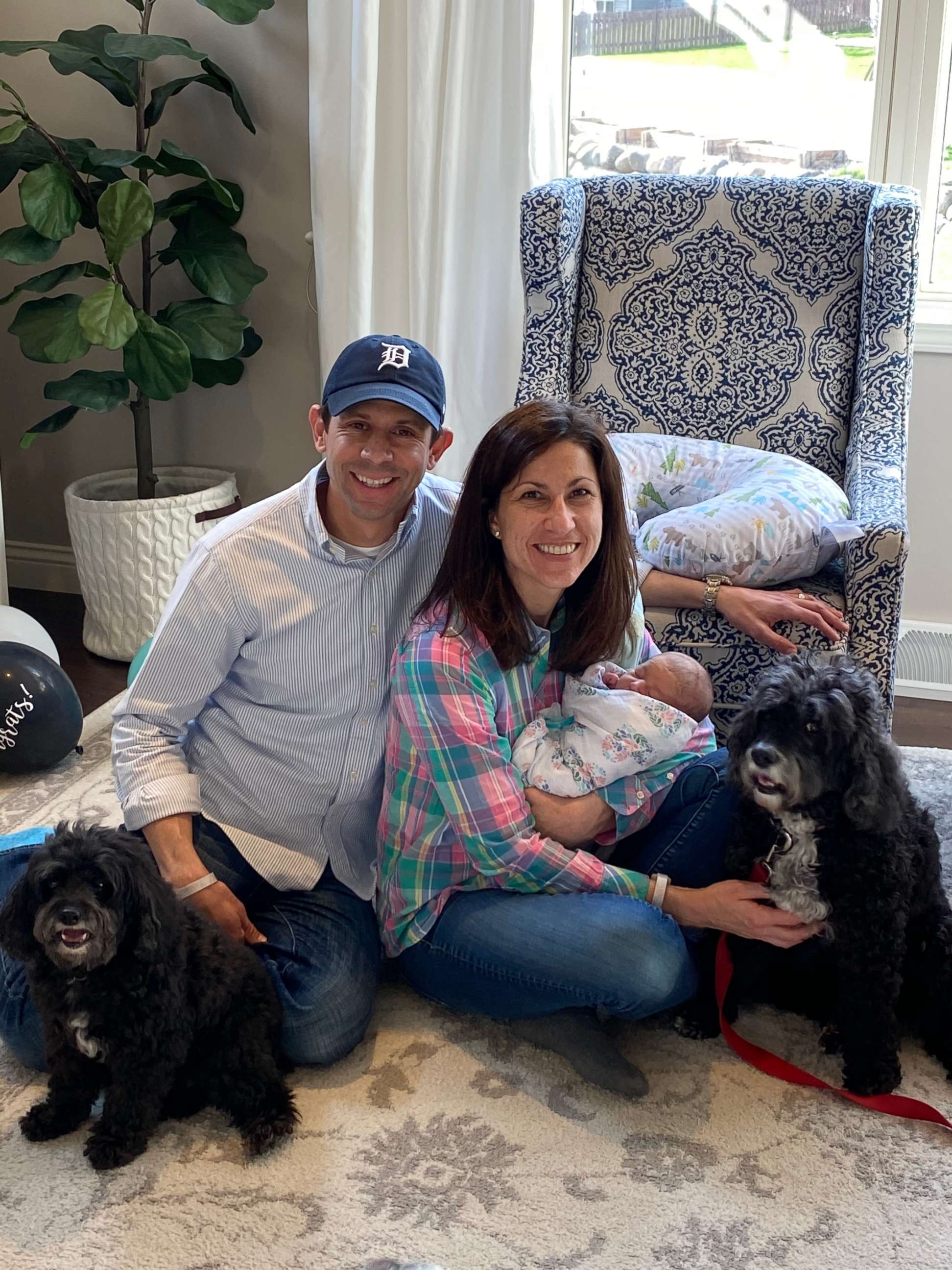 PHOTO: Cara Skowronski and her husband hold their daughter, who was born via a gestational surrogate.