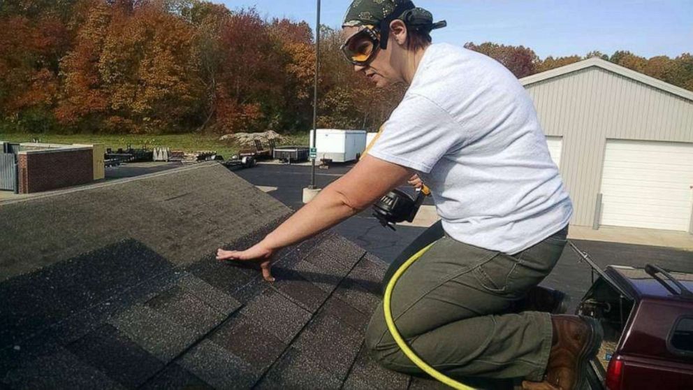 Carlyn McClelland handles the roofing work during a construction project.