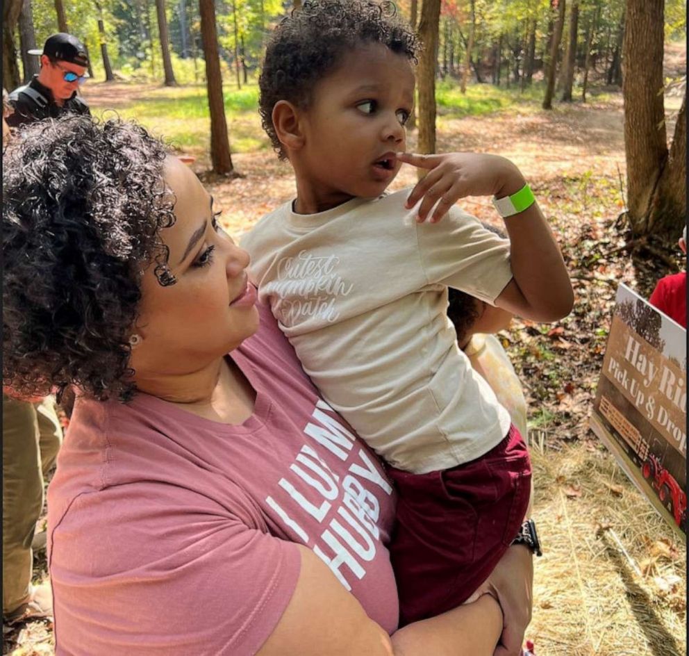 PHOTO: Cierra Chubb holds her son during a family outing after her months-long hospitalization due to COVID-19.