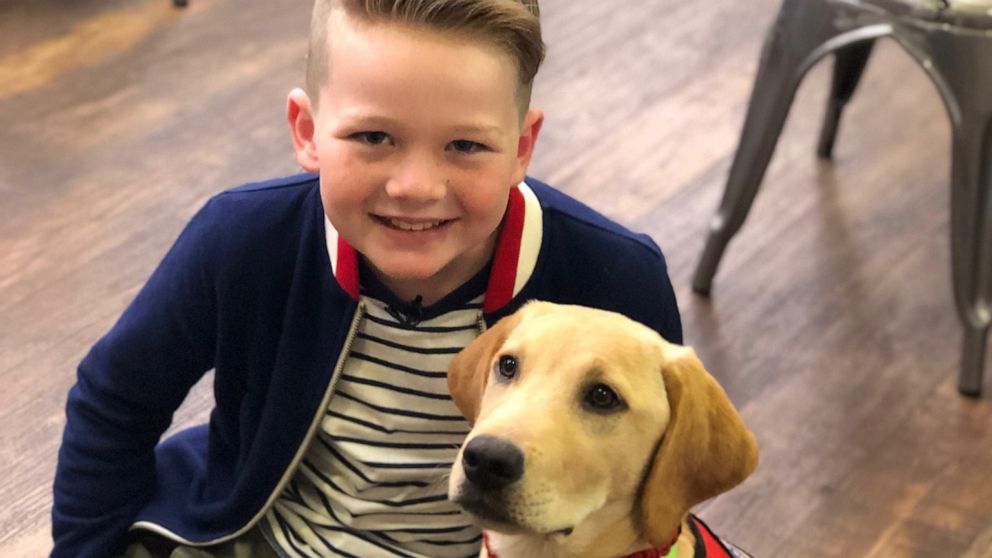 PHOTO: Eli, who has type 1 diabetes, poses with his new diabetes alert dog.