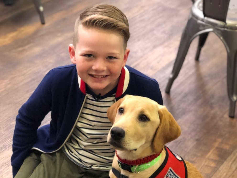 PHOTO: Eli, who has type 1 diabetes, poses with his new diabetes alert dog.