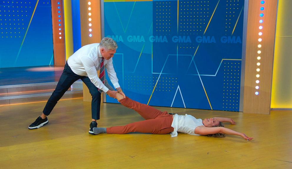 PHOTO: "Good Morning America" meteorologists Sam Champion and Ginger Zee try the viral "Dancing With the Stars" leg lift move performed by Witney Carson and Danny Amendola.