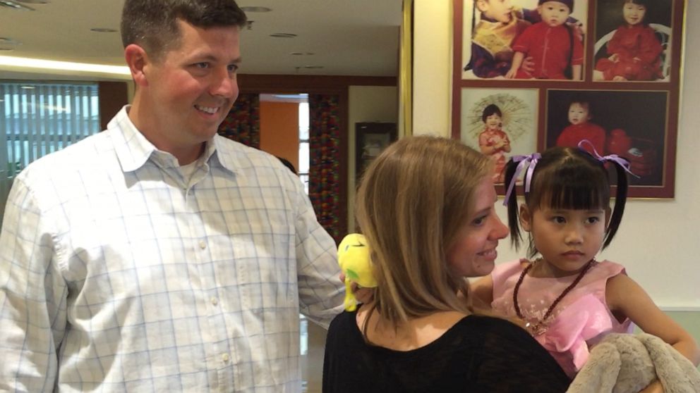 PHOTO: David and Kerry Mills meet their daughter Esther in China.