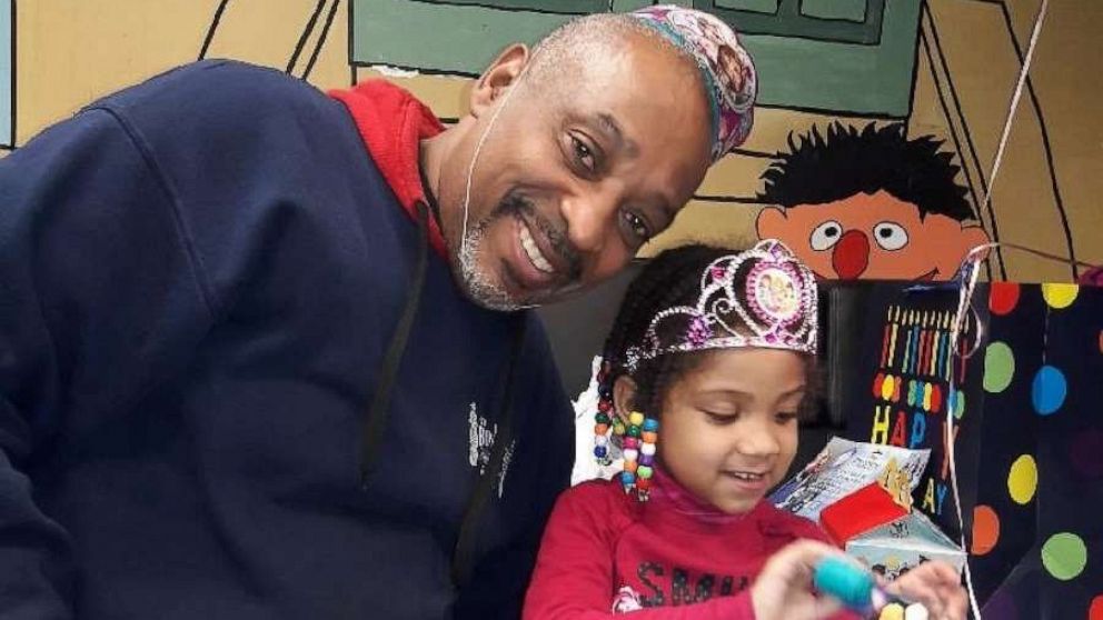 PHOTO: Oswaldo Ortiz, who received a Bags for Dads from Fathers’ UpLift, poses with his daughter.