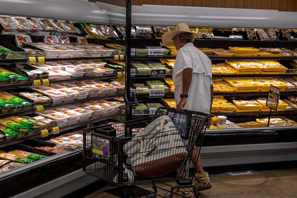PHOTO: A customer views packages of poultry for sale at a Safeway grocery store in Scottsdale, Ariz., Oct. 18, 2021.