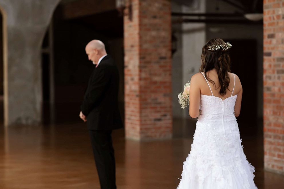 PHOTO: Jason Halbert, who is battling brain cancer, dances with daughters Ashlee and Kaylee.