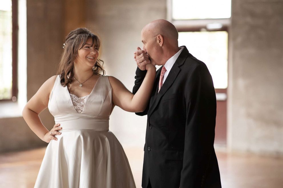 PHOTO: Jason Halbert, who is battling brain cancer, dances with daughters Ashlee and Kaylee.