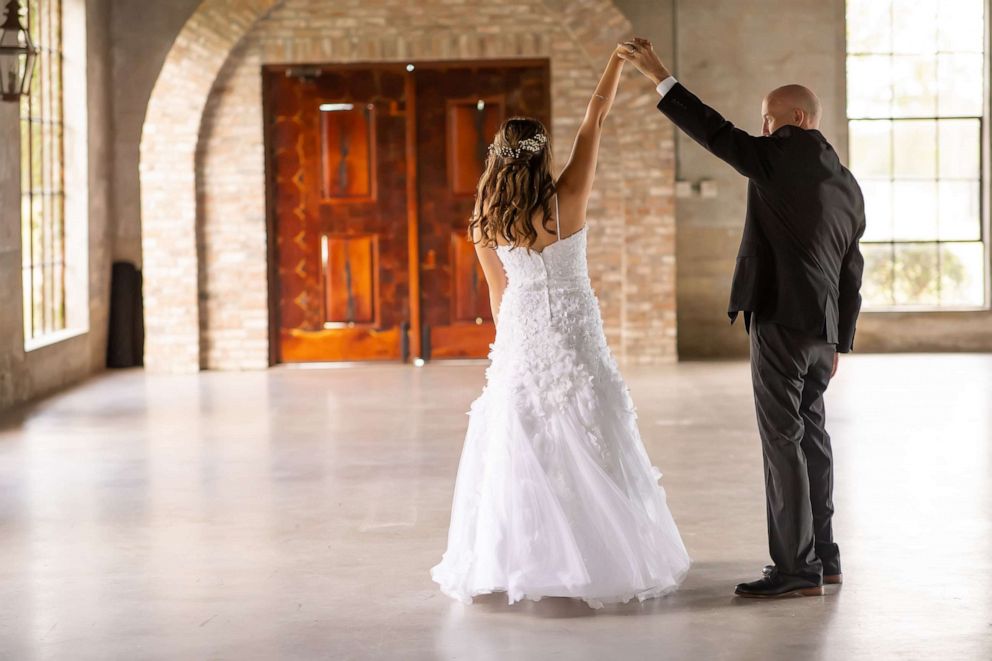 PHOTO: Jason Halbert, who is battling brain cancer, dances with daughters Ashlee and Kaylee.