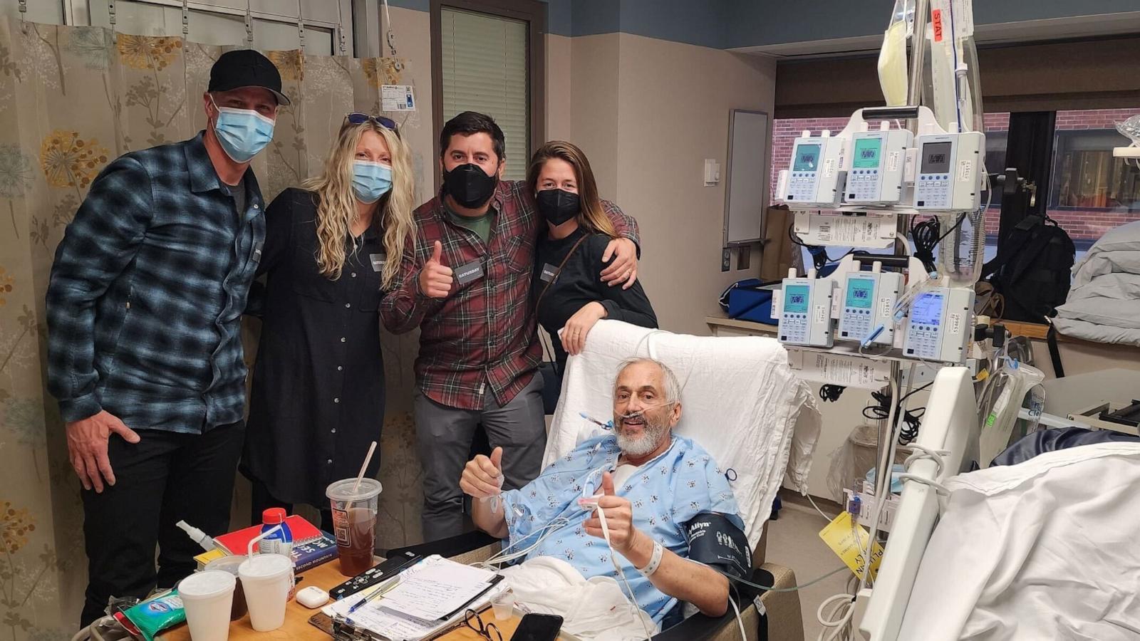 John Neuenschwander poses with family after his heart transplant.