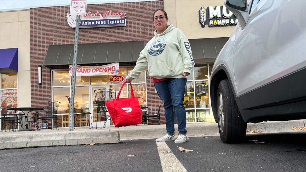 PHOTO: Jackie Poole, a mother of two, supplements her income by delivering for DoorDash.