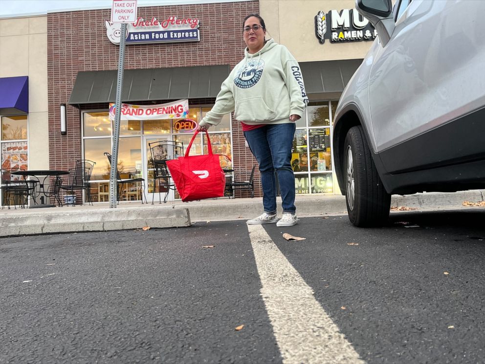 PHOTO: Jackie Poole, a mother of two, supplements her income by delivering for DoorDash.