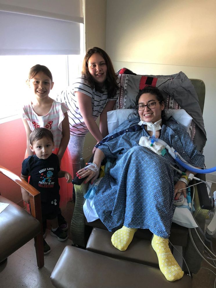 PHOTO: Jazmin Kirkland, of Texas, poses with her three children while hospitalized during her battle with COVID-19.