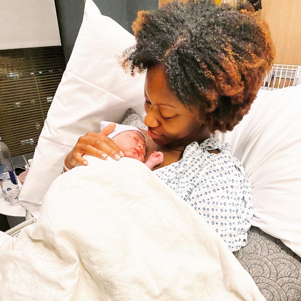 PHOTO: Jenny Laroche, of New York, holds her newborn daughter.