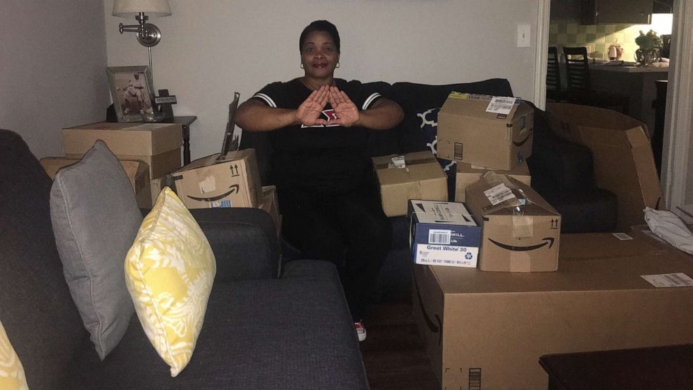PHOTO: Michelle Lindsey poses with school supplies donated by members of Delta Sigma Theta Sorority.