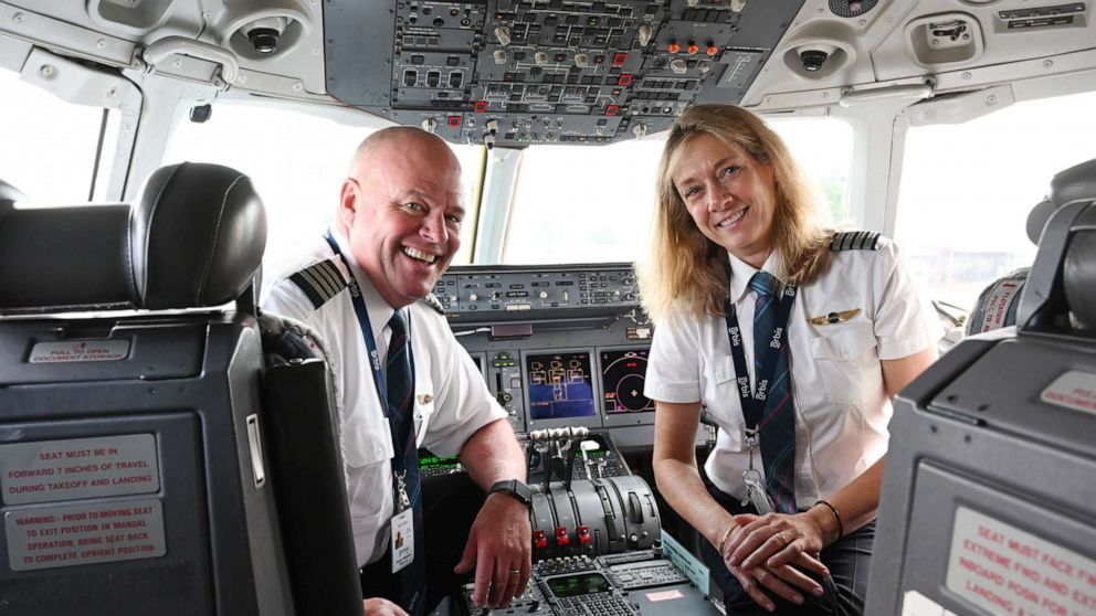 PHOTO: Peter and Cheryl Pitzer pose together in the cockpit of an Orbis plane.