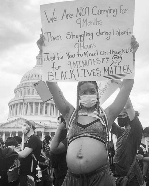 Pregnant woman's protest sign sends powerful message on being a ...