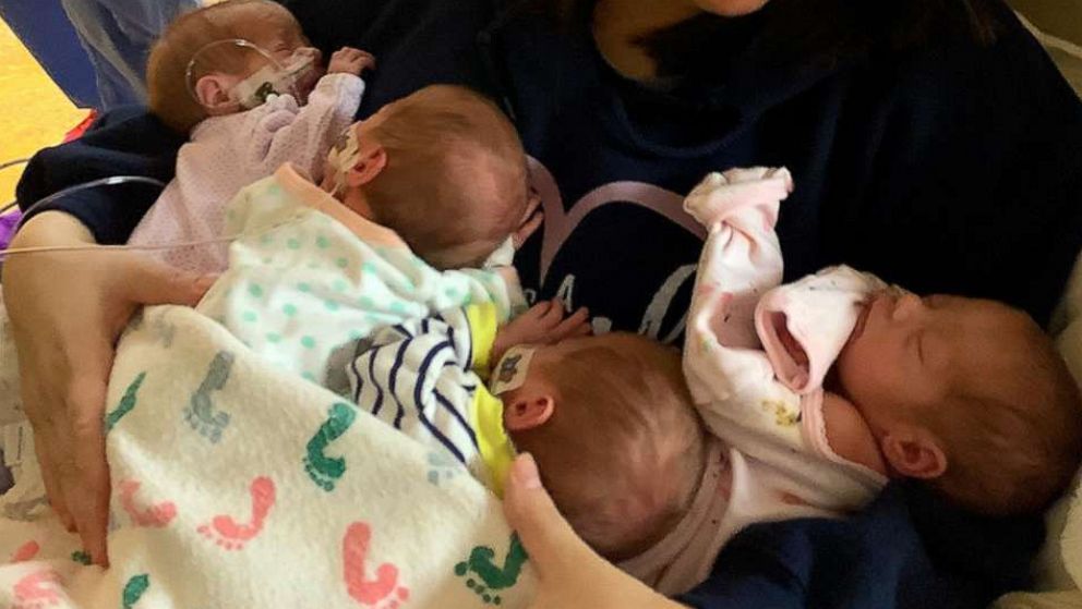 PHOTO: Taylor Becher, of Minnesota, holds her identical quadruplet daughters who were born on March 11, 2020.