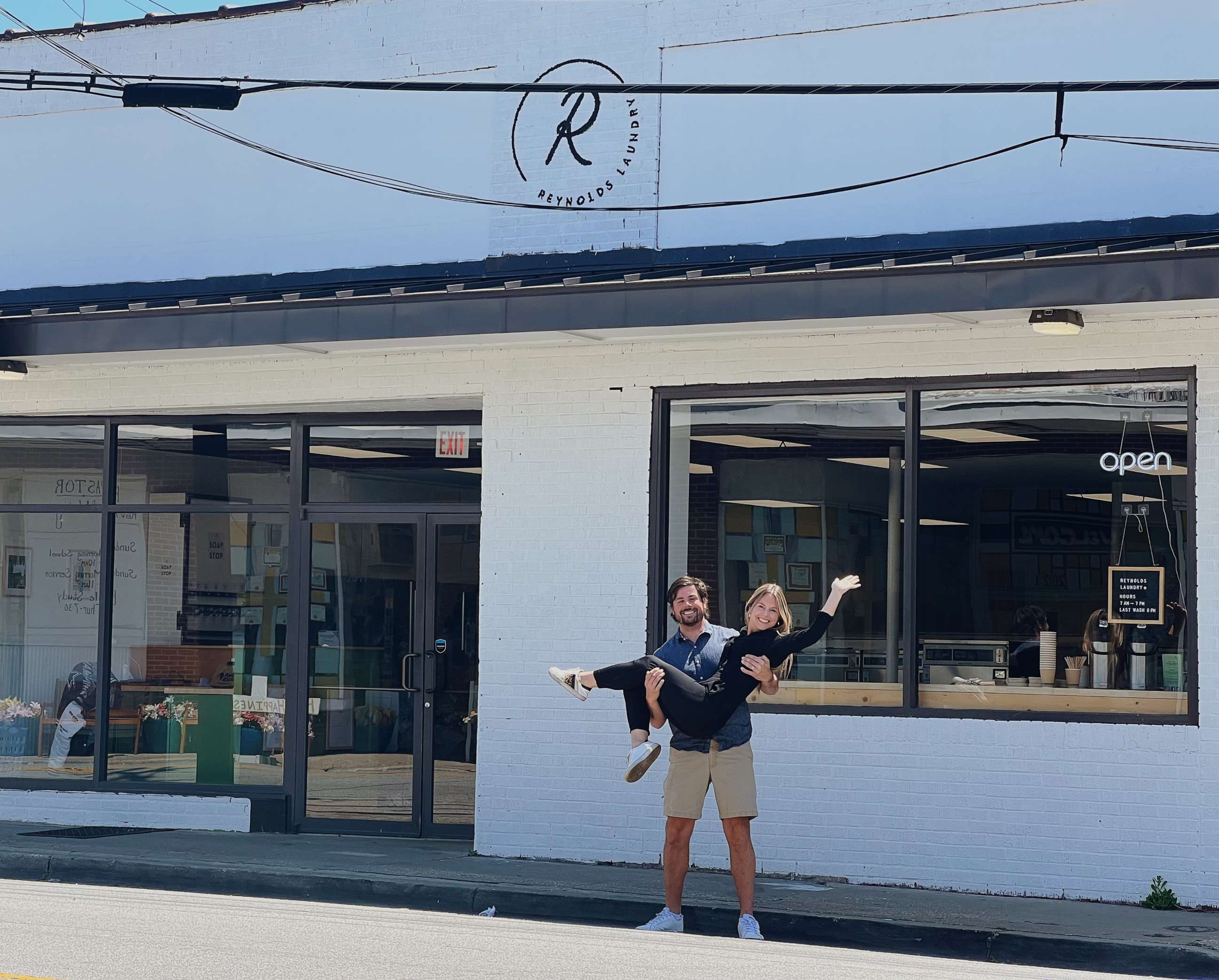 PHOTO: Jon and Erin Carpenter pose in front of Reynolds Laundromat in Charleston, South Carolina.