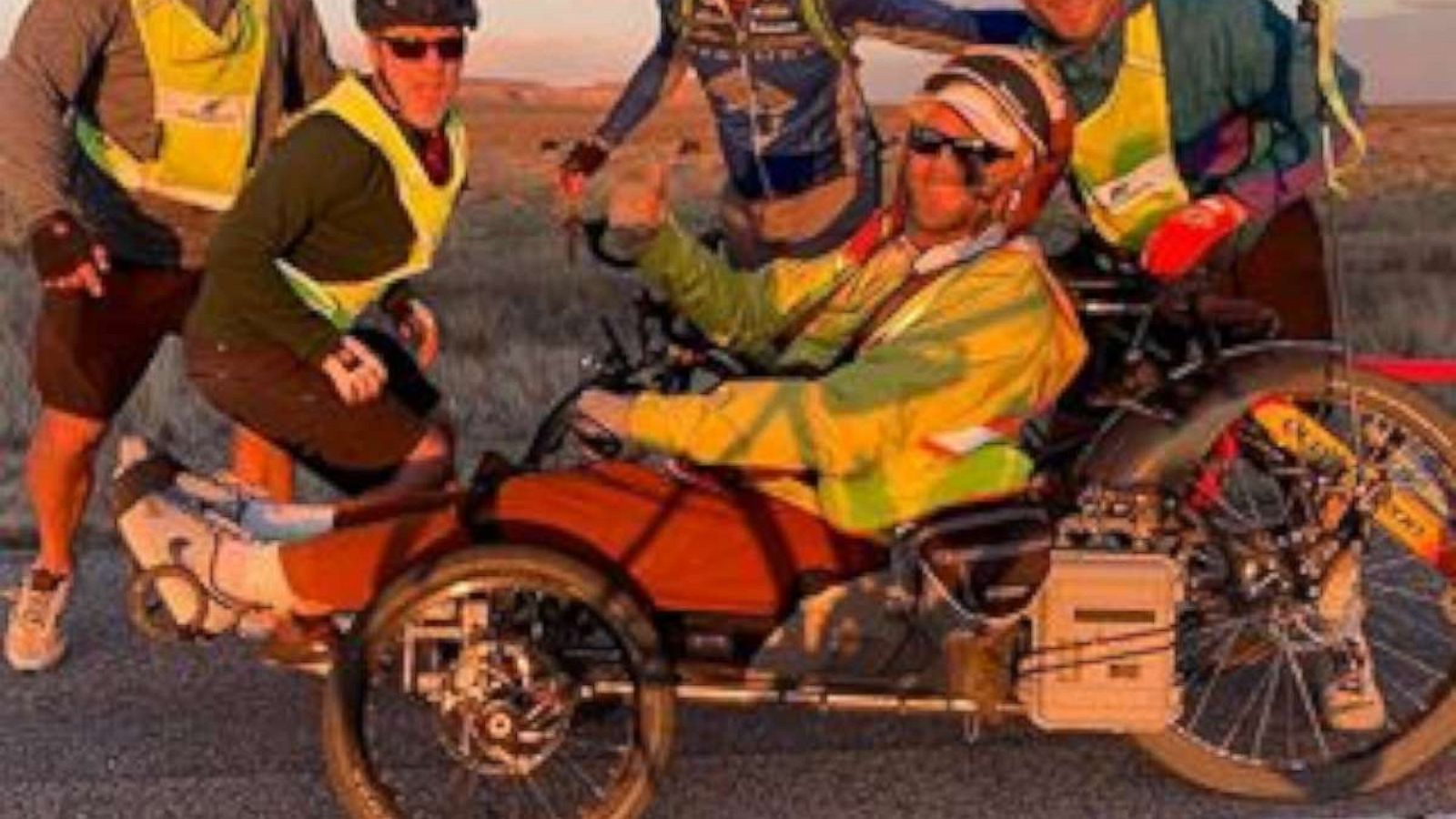 PHOTO: Janne Kouri poses with friends on his cross-country ride to raise awareness for people living with paralysis.