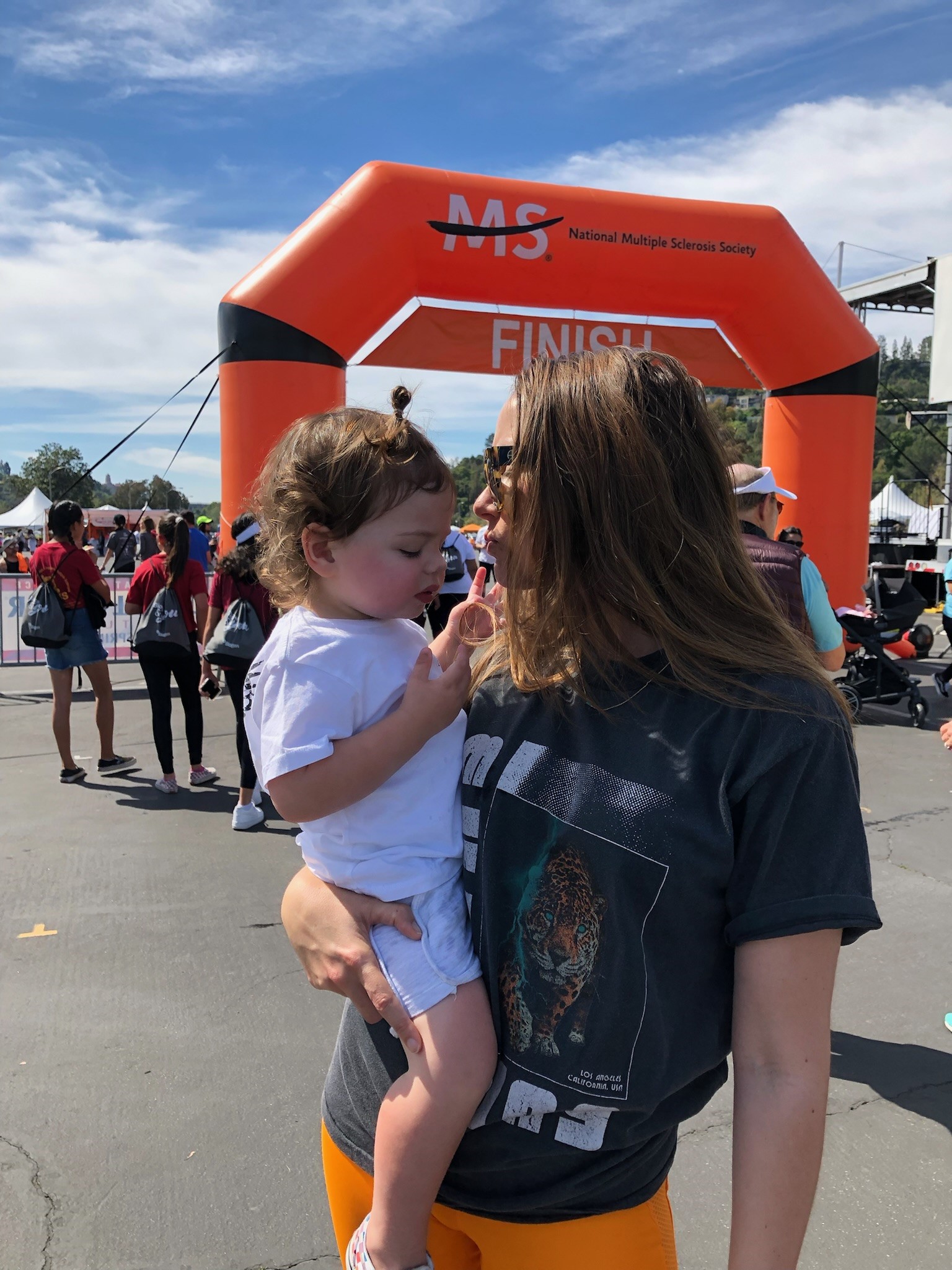 PHOTO: Sarah Wolfe, 37, holds her child at a National MS Society walk in the Los Angeles area.