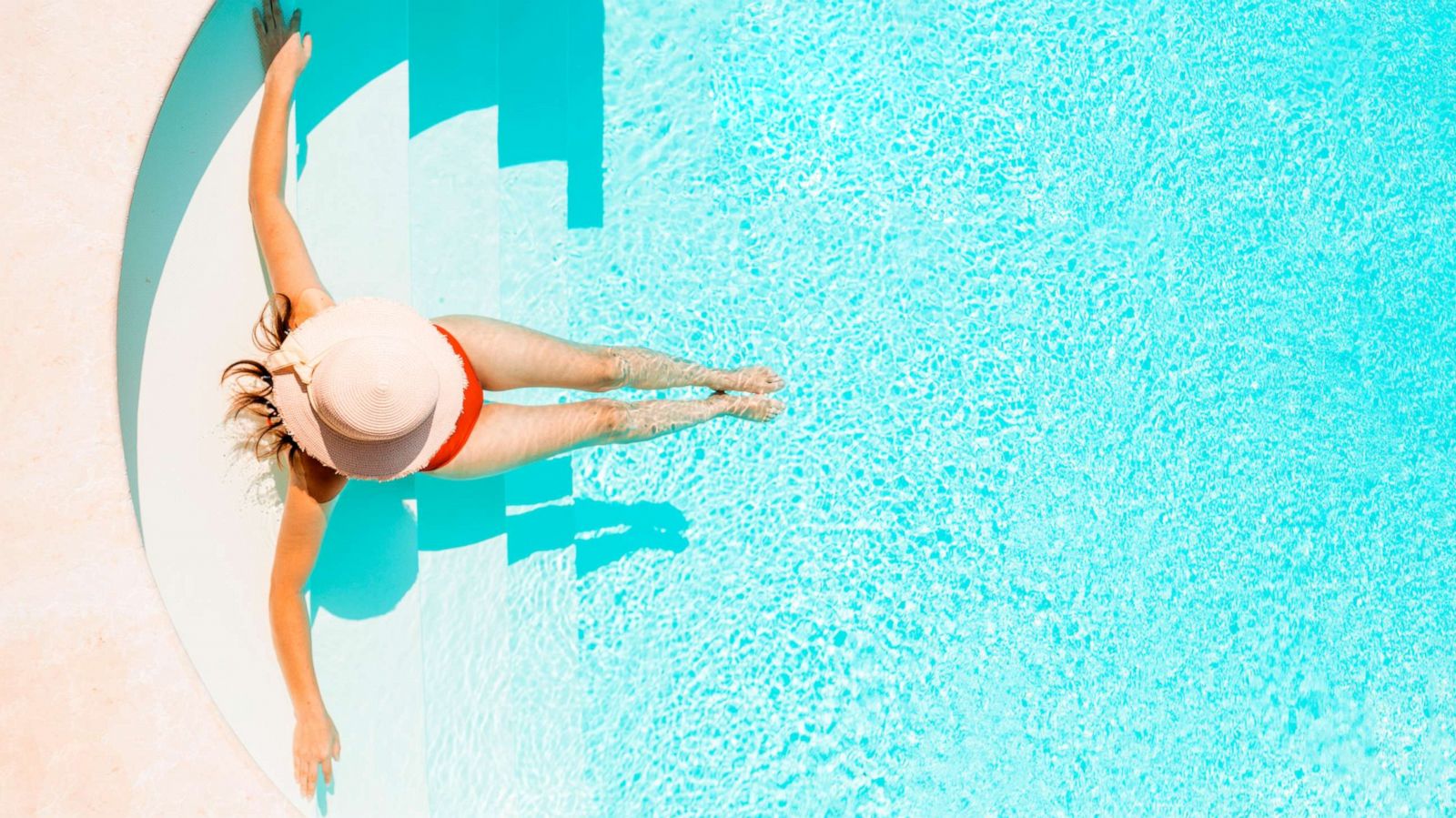 PHOTO: A sunbather sits in a pool in an undated stock image.