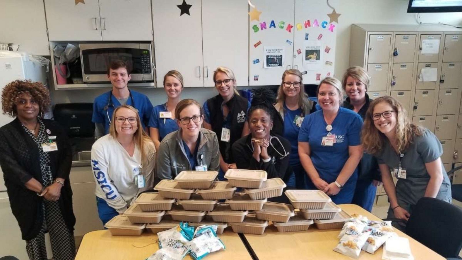 PHOTO: Hospital workers in Charleston, South Carolina, pose with food donated through an initiative started by Whitney Klomparens, Suzi Pigg and Leigh Ann Garrett.