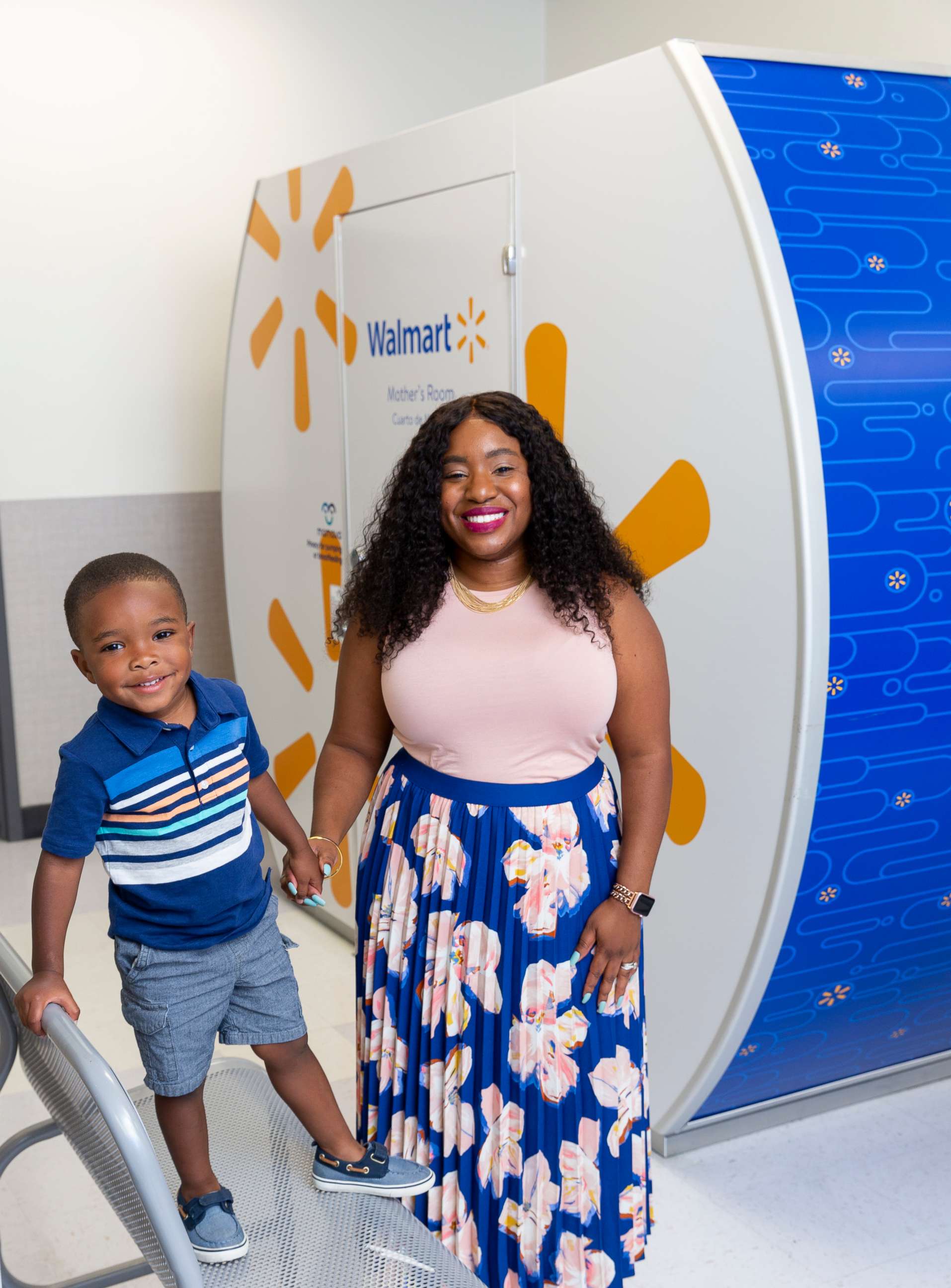 PHOTO: Tennille Webb poses with her son in front of a Mamava breastfeeding pod at a Walmart store.