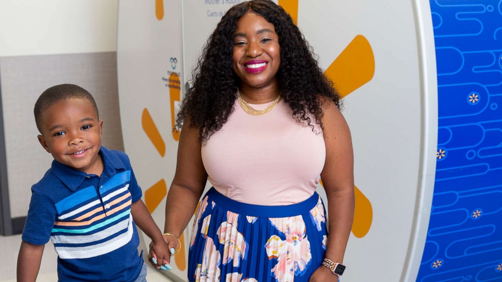 PHOTO: Tennille Webb poses with her son in front of a Mamava breastfeeding pod at a Walmart store.